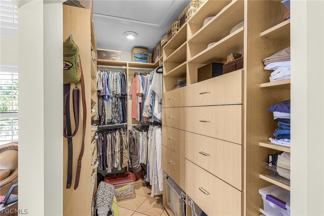 7747 Grande Pine Road Bokeelia, FL 33922 - Photo 22 of 45 a view of walk in closet with clothes and shoes