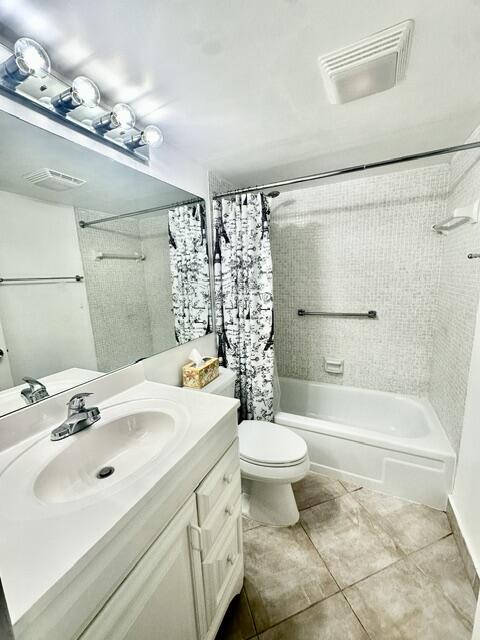 1047 Exeter C Boca Raton, FL 33434 - Photo 9 of 37 a bathroom with a sink toilet a mirror and shower