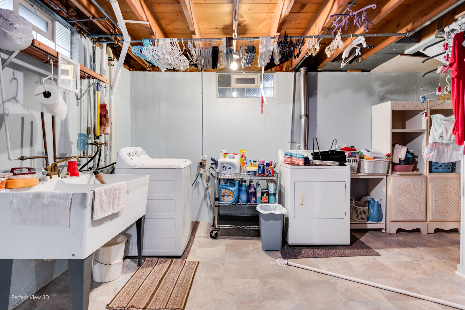 210 South Reed Street Joliet, IL 60436 - Photo 11 of 13 a utility room with cabinets and washer