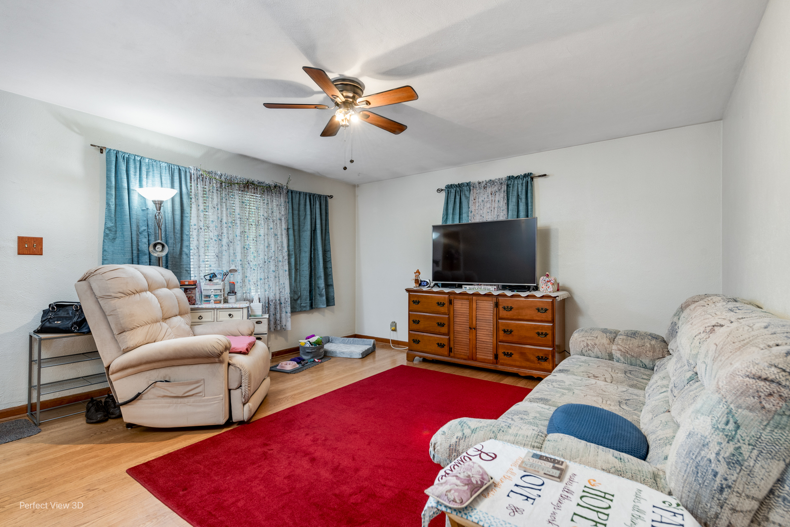 210 South Reed Street Joliet, IL 60436 - Photo 3 of 13 a living room with furniture and a flat screen tv
