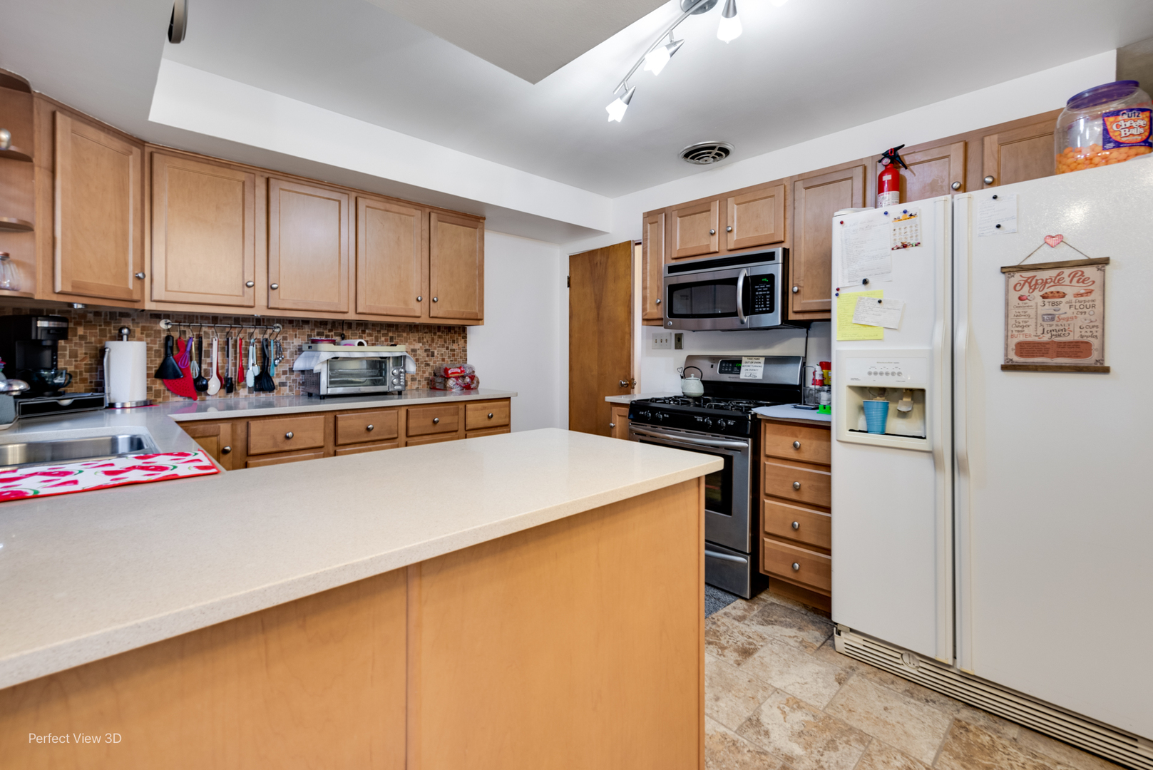 210 South Reed Street Joliet, IL 60436 - Photo 4 of 13 a kitchen with stainless steel appliances a refrigerator sink and microwave