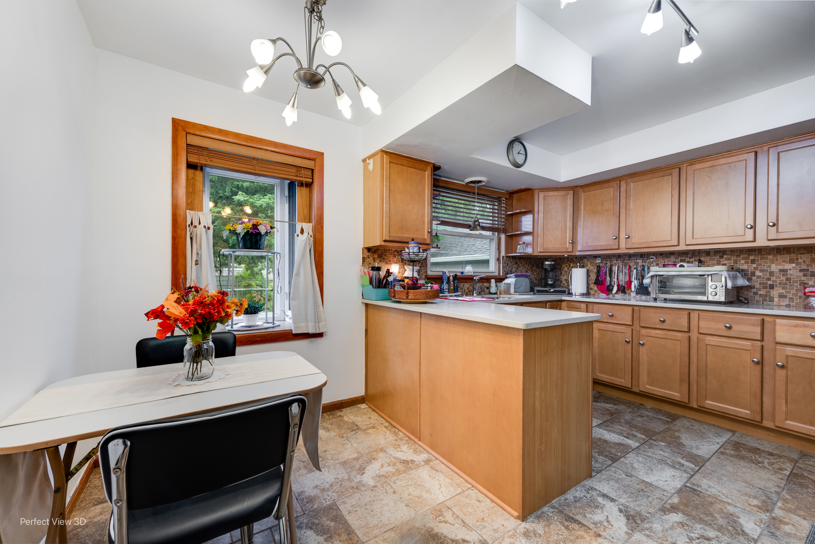 210 South Reed Street Joliet, IL 60436 - Photo 5 of 13 a kitchen with stainless steel appliances a sink stove and cabinets