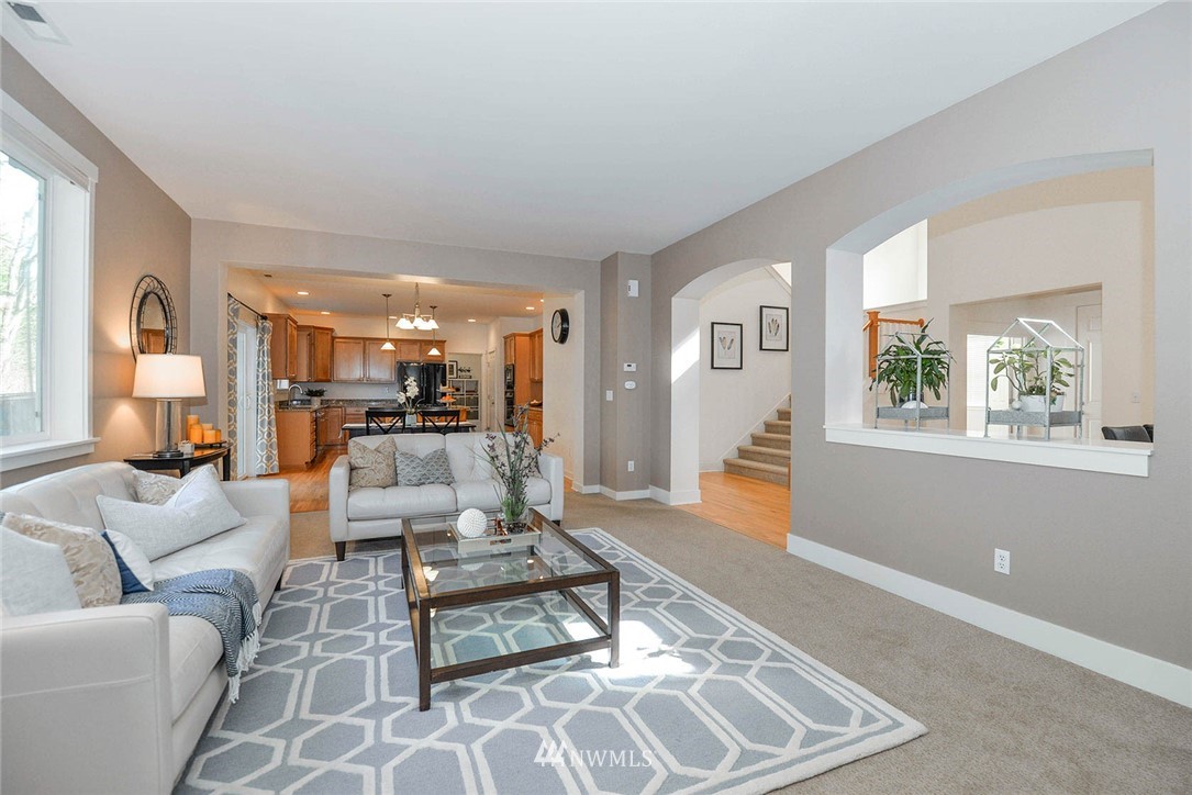 21814 41st Avenue Southeast Bothell, WA 98021 - Photo 11 of 30 a living room with furniture and a wooden floor