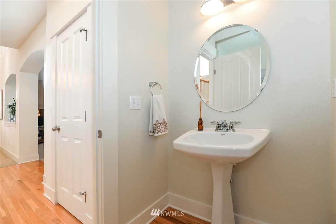 21814 41st Avenue Southeast Bothell, WA 98021 - Photo 17 of 30 a bathroom with a sink a mirror a vanity and shower