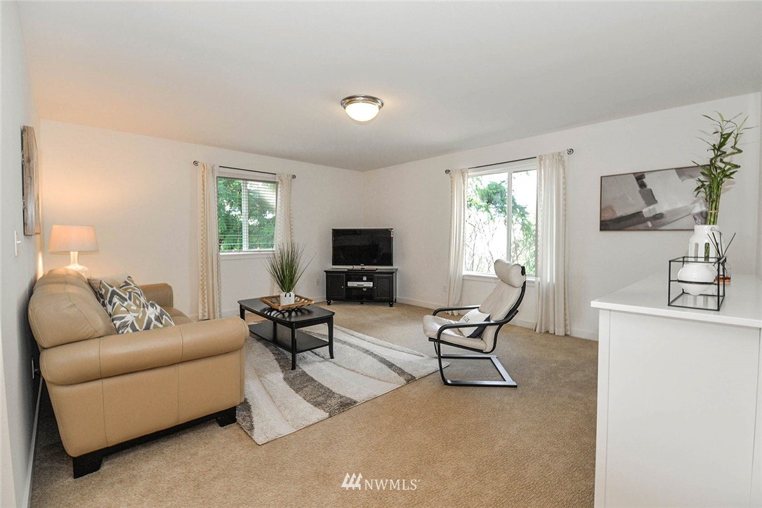 21814 41st Avenue Southeast Bothell, WA 98021 - Photo 24 of 30 a living room with furniture and a window