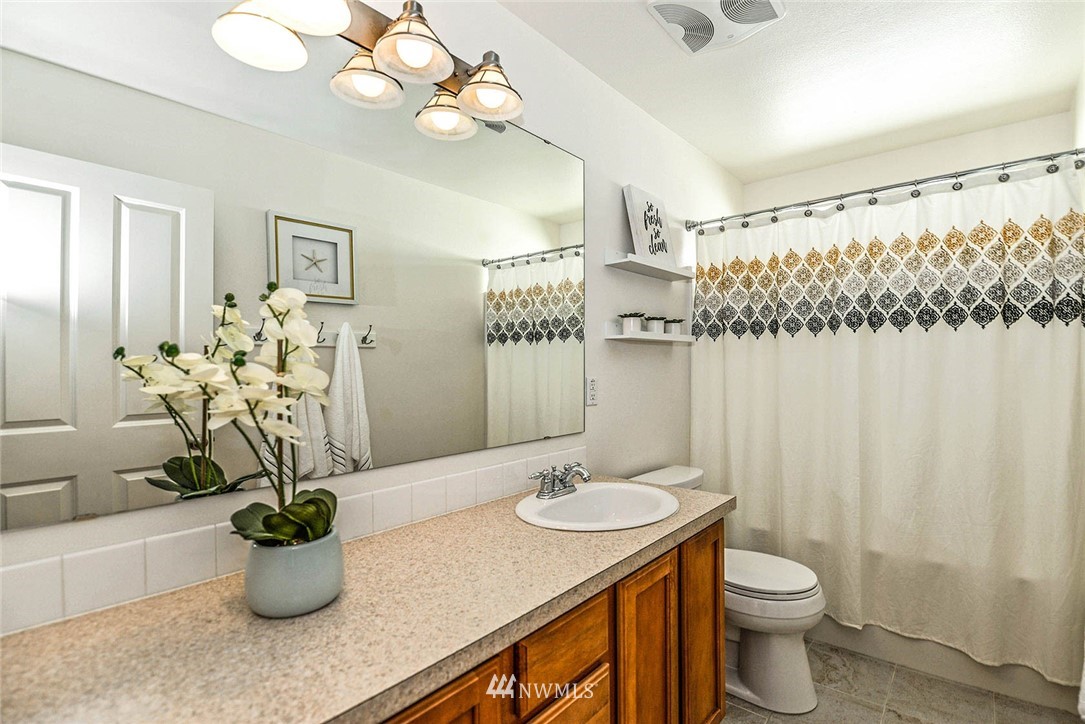 21814 41st Avenue Southeast Bothell, WA 98021 - Photo 26 of 30 a bathroom with a sink a toilet and a shower
