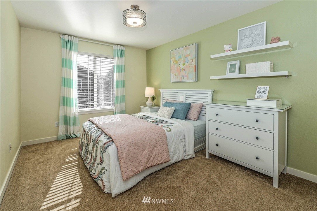21814 41st Avenue Southeast Bothell, WA 98021 - Photo 28 of 30 a bedroom with a bed and a window