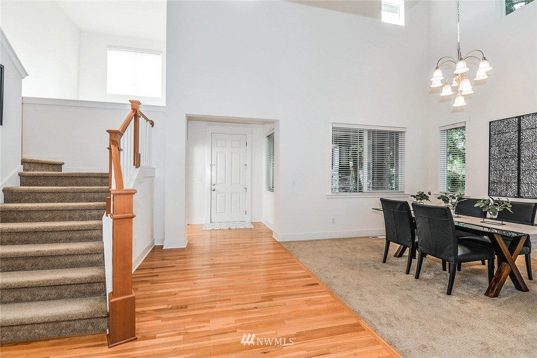 21814 41st Avenue Southeast Bothell, WA 98021 - Photo 4 of 30 a view of a dining room with furniture and chandelier