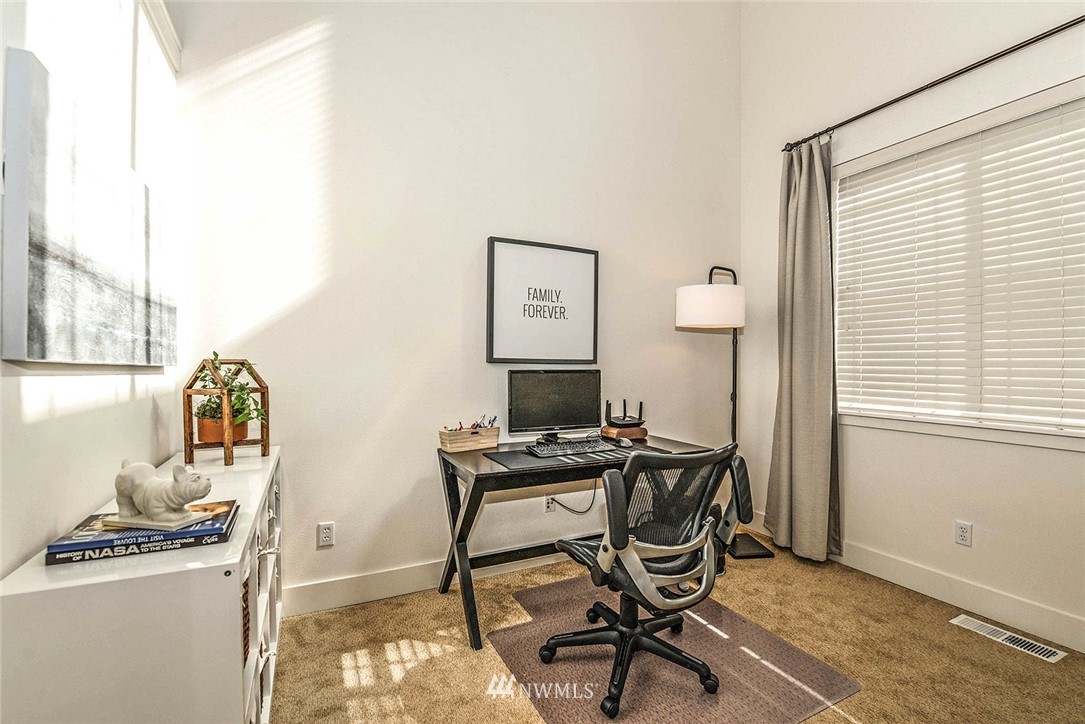 21814 41st Avenue Southeast Bothell, WA 98021 - Photo 8 of 30 a view of a workspace with furniture and a window
