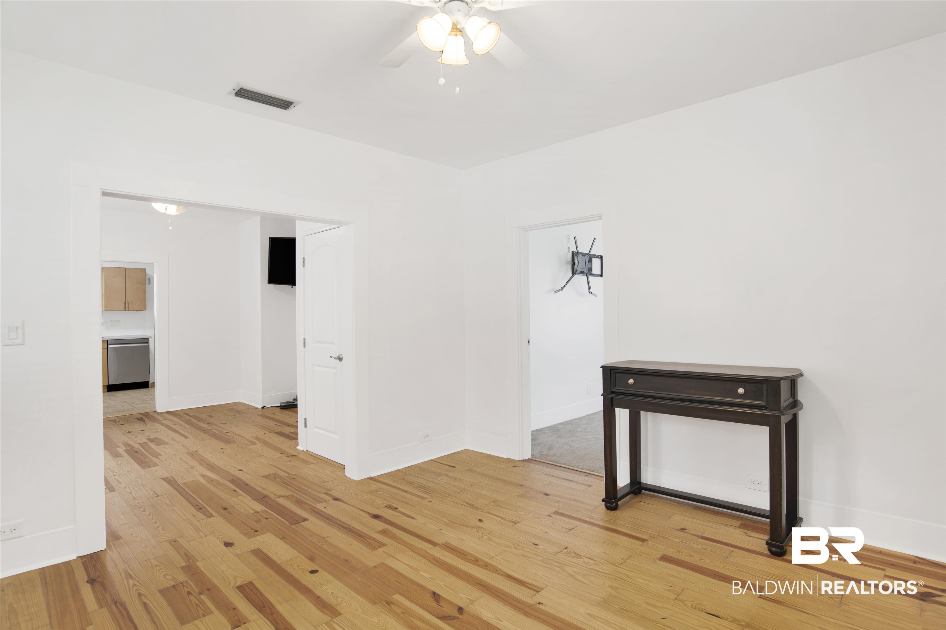 507 Holcombe Avenue Mobile, AL 36606 - Photo 22 of 28 Empty room with light wood-style floors, ceiling fan, and baseboards
