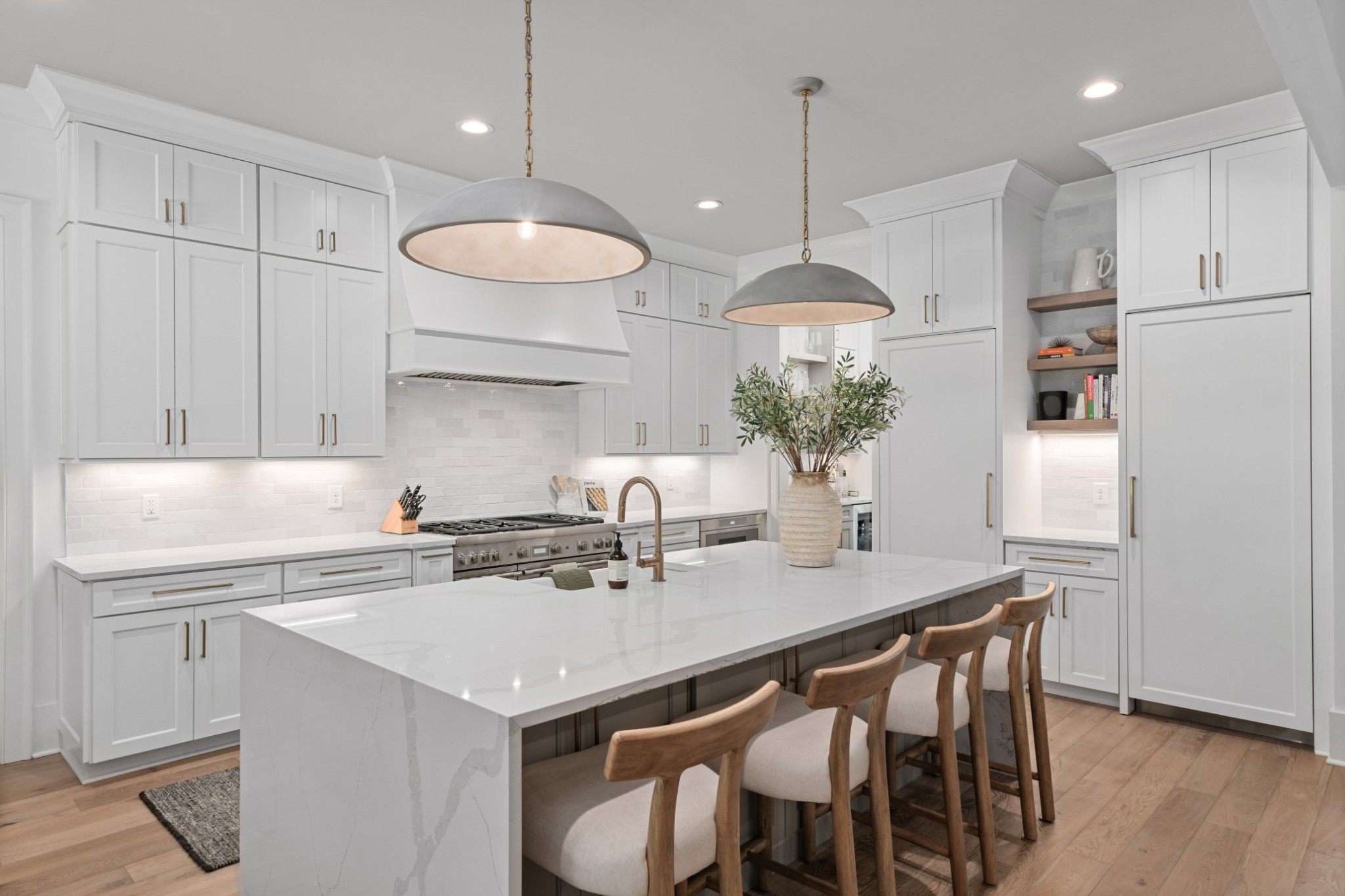 2847 Sugar Tree Road Nashville, TN 37215 - Photo 16 of 52 a kitchen with a table a sink cabinets and wooden floor