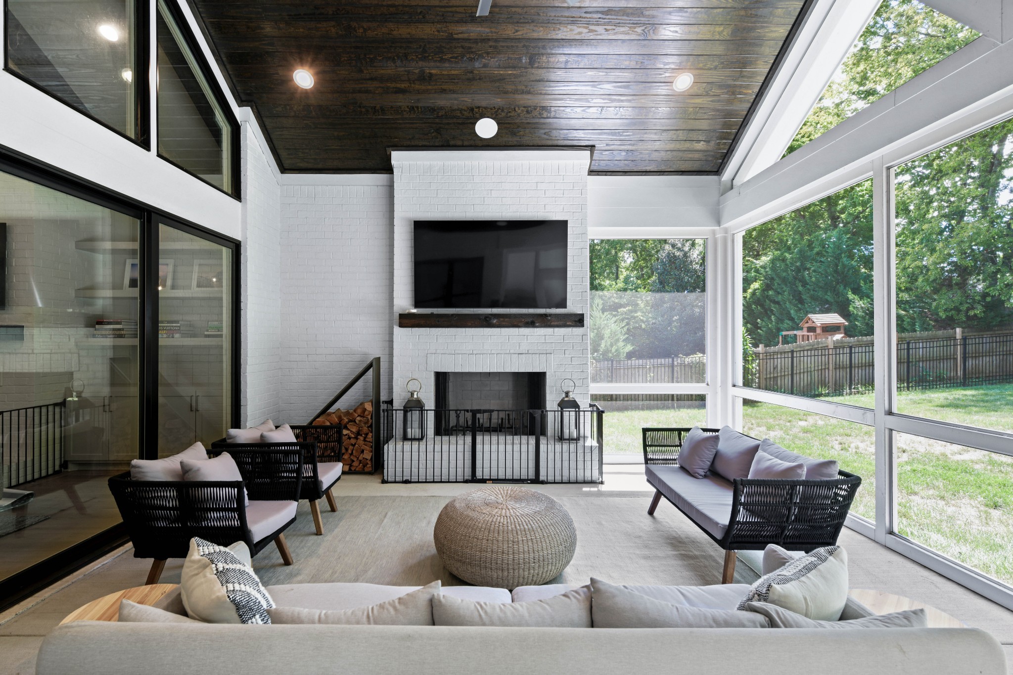 2847 Sugar Tree Road Nashville, TN 37215 - Photo 21 of 52 a living room with furniture a fireplace and a floor to ceiling window