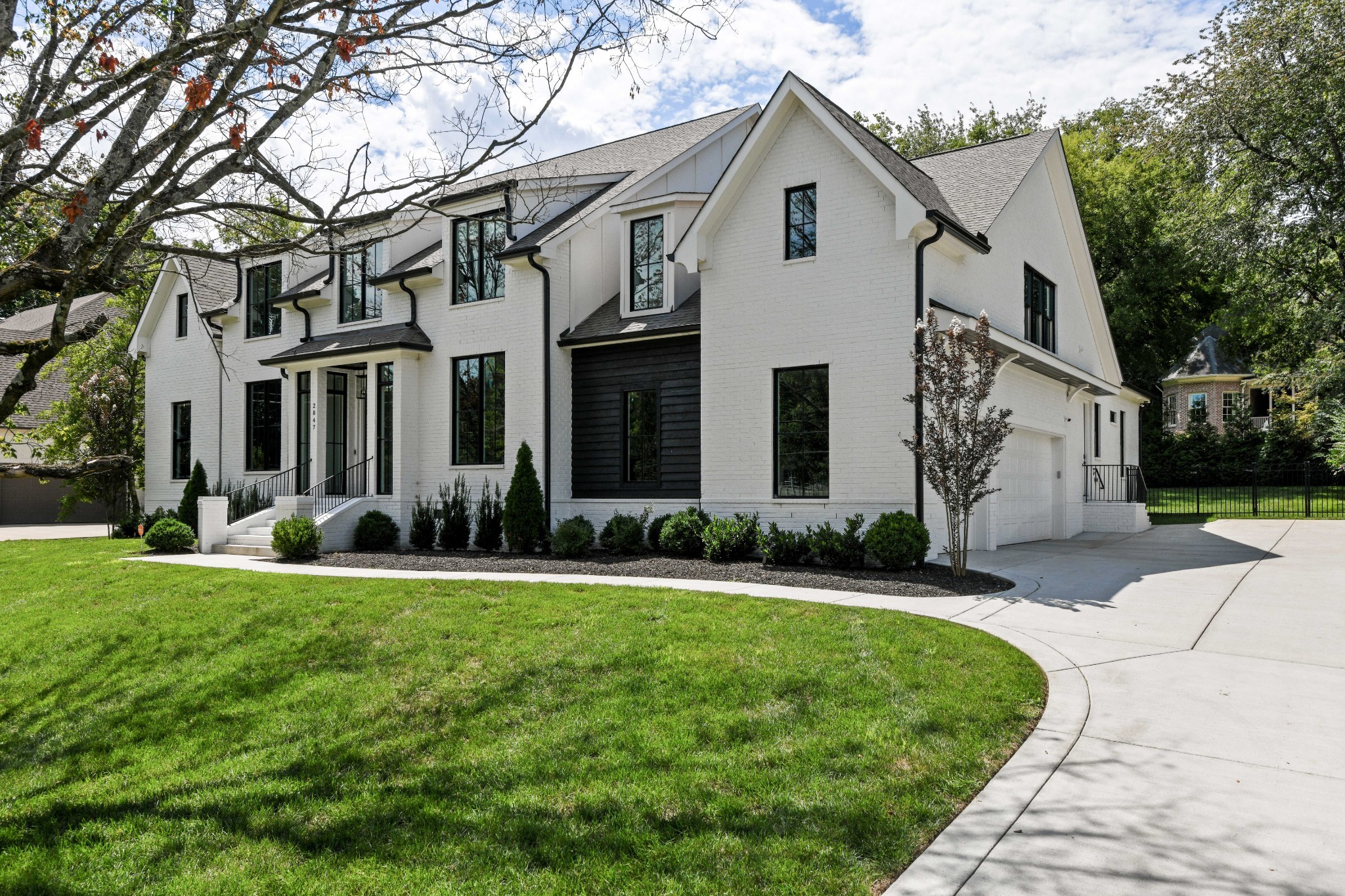 2847 Sugar Tree Road Nashville, TN 37215 - Photo 3 of 52 a front view of a house with a yard and trees