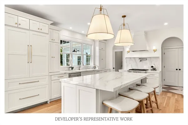 a open kitchen view with living table and chairs