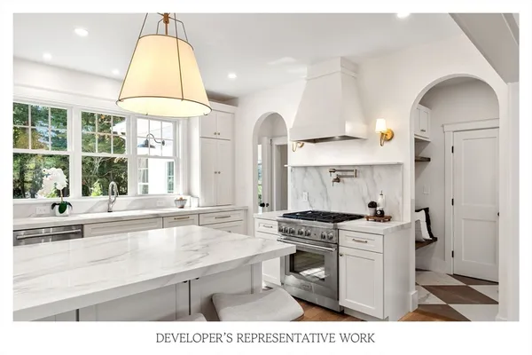 a bathroom with a sink a vanity and a large mirror