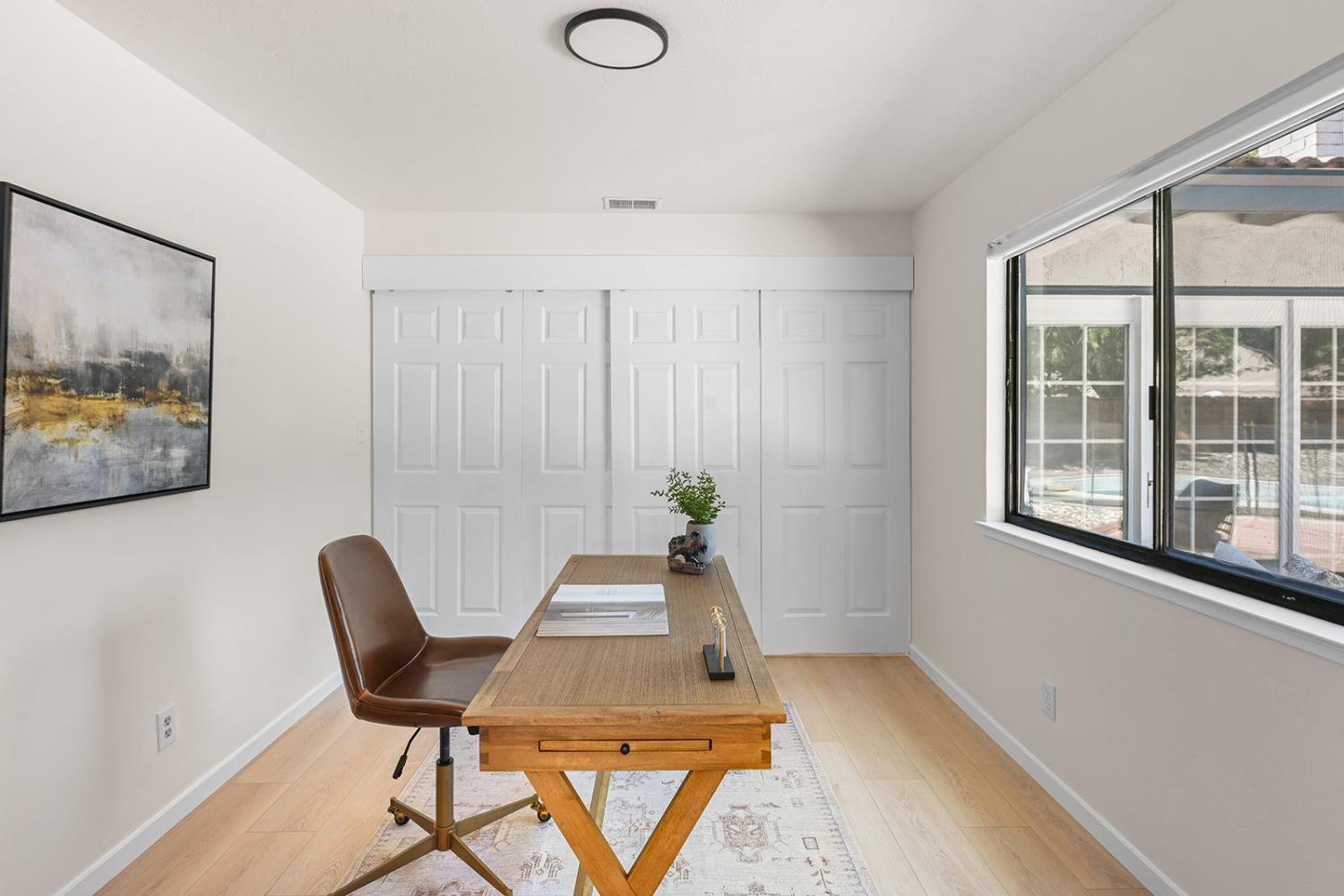 4121 Vista Way Davis, CA 95618 - Photo 12 of 32 a view of a workspace with furniture and a window