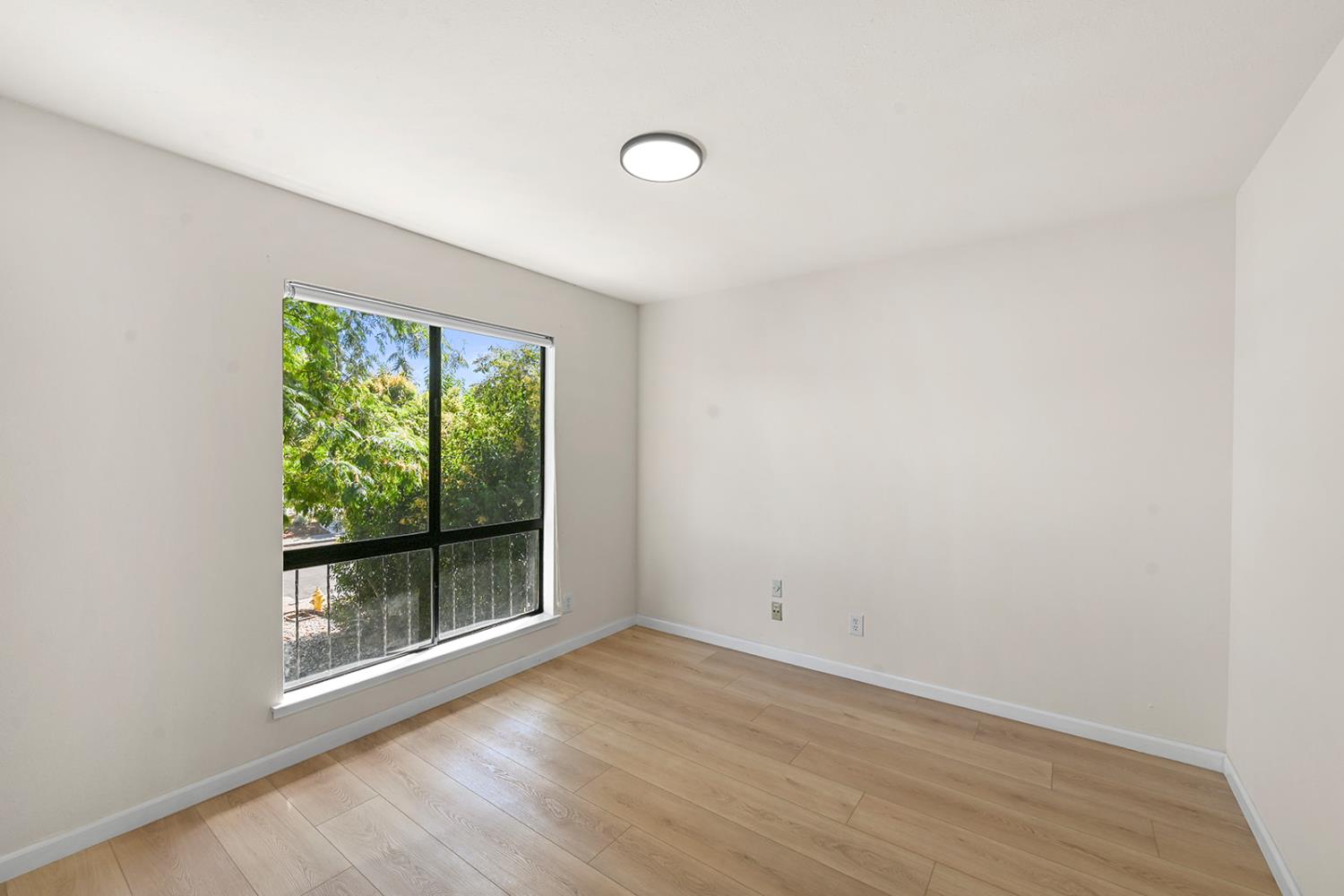 4121 Vista Way Davis, CA 95618 - Photo 19 of 32 a view of a room with wooden floor and window