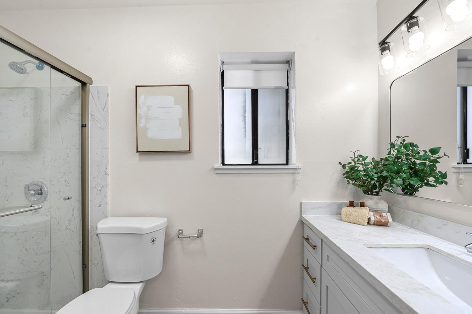 4121 Vista Way Davis, CA 95618 - Photo 22 of 32 a bathroom with a sink toilet and shower