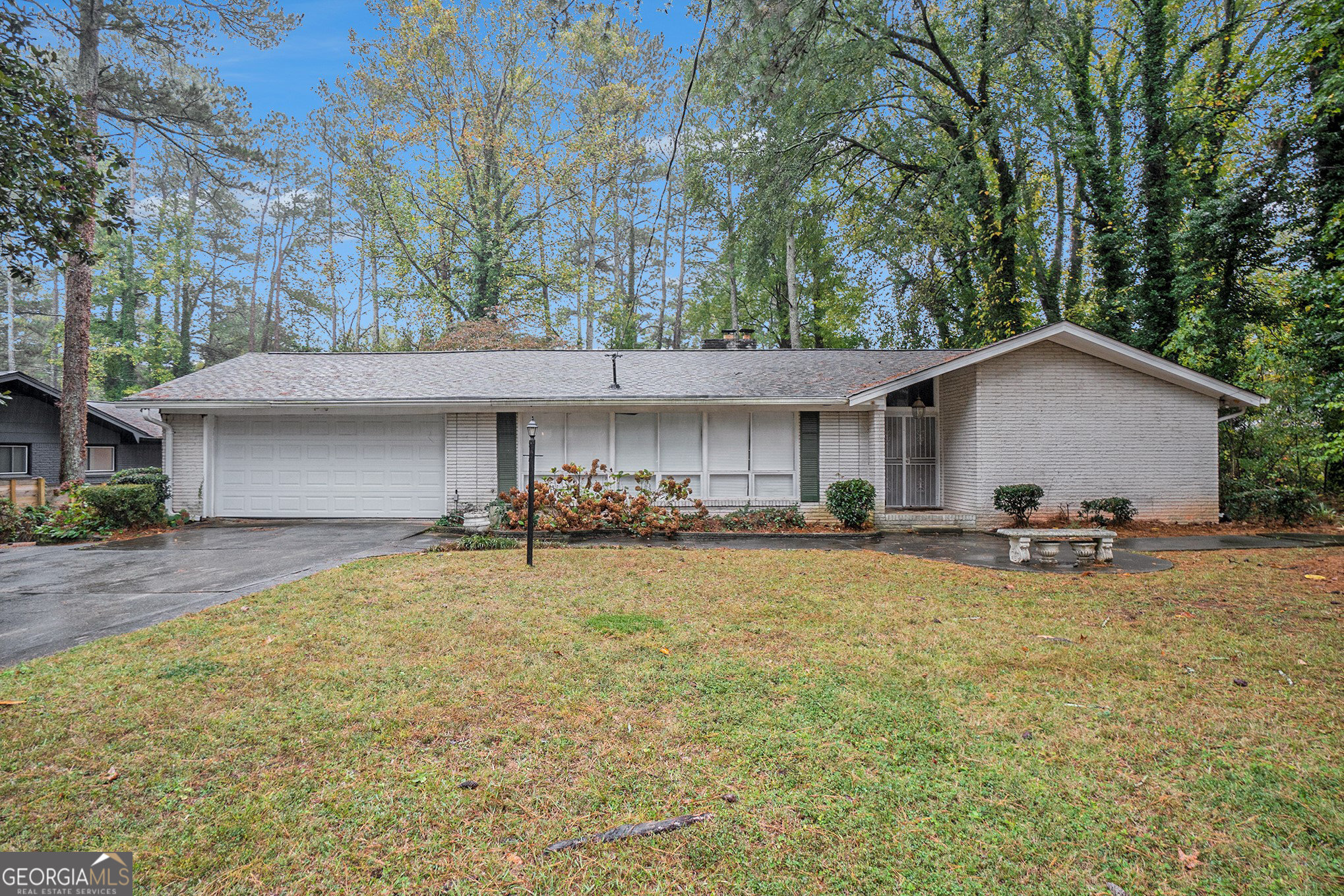 a view of a house with swimming pool and sitting area