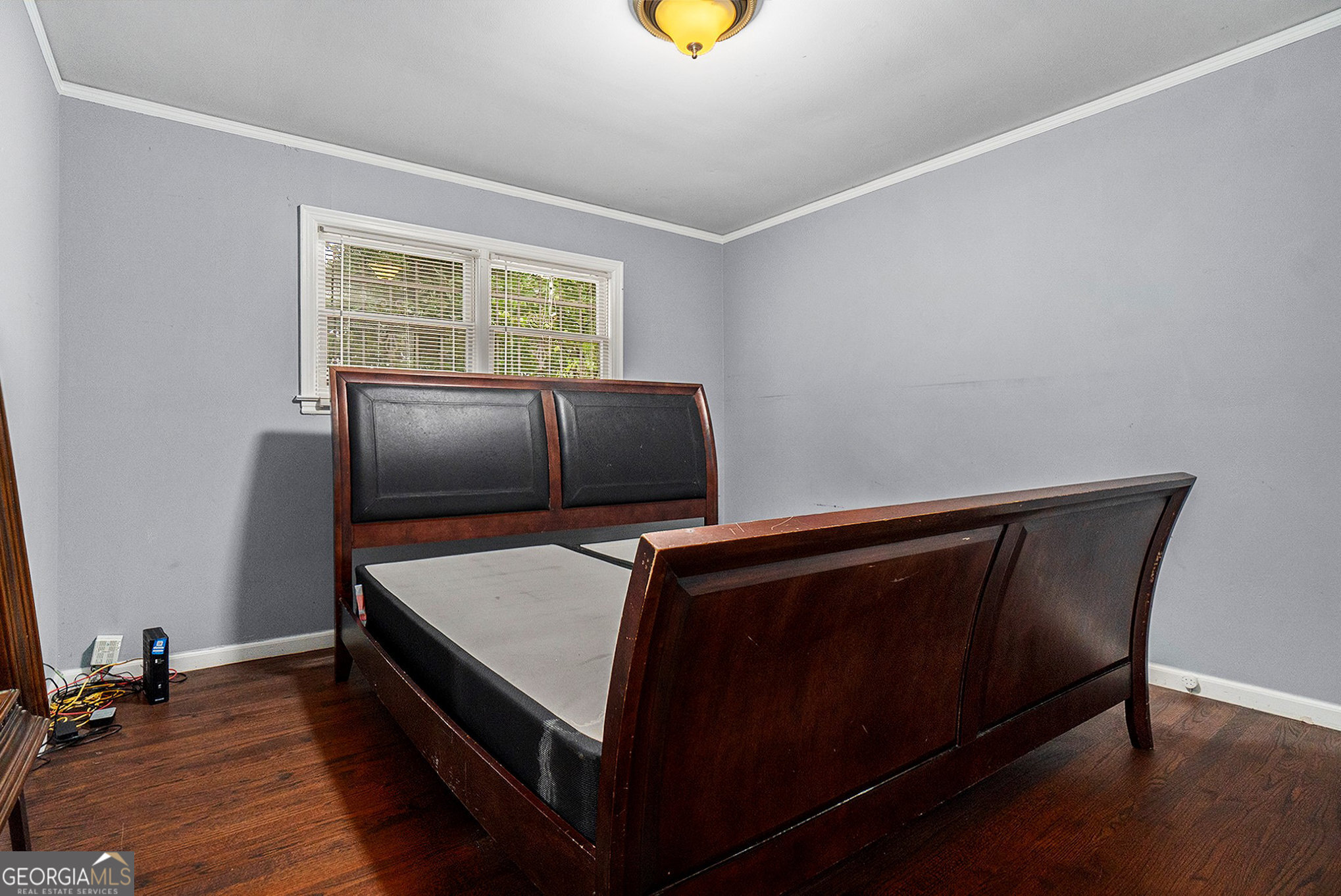 3382 Bobolink Circle Southwest Atlanta, GA 30311 - Photo 11 of 15 a living room with a bed furniture and a window