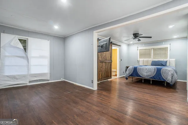 a view of a livingroom with furniture and a window