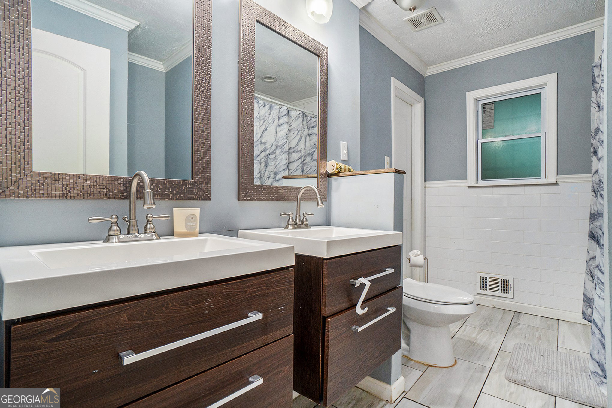 3382 Bobolink Circle Southwest Atlanta, GA 30311 - Photo 13 of 15 a bathroom with a sink toilet and mirror