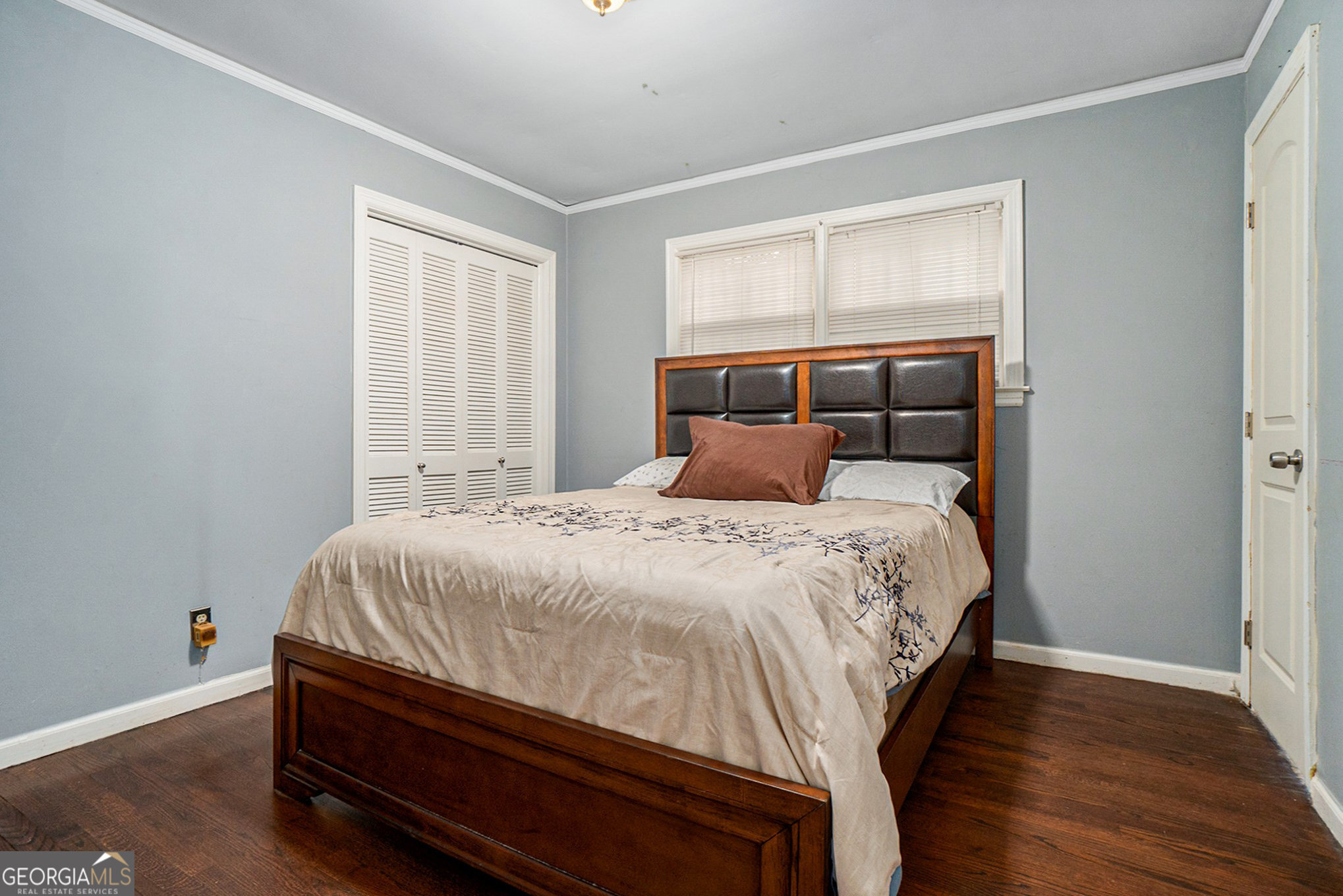 3382 Bobolink Circle Southwest Atlanta, GA 30311 - Photo 14 of 15 a bed sitting in a bedroom next to a window