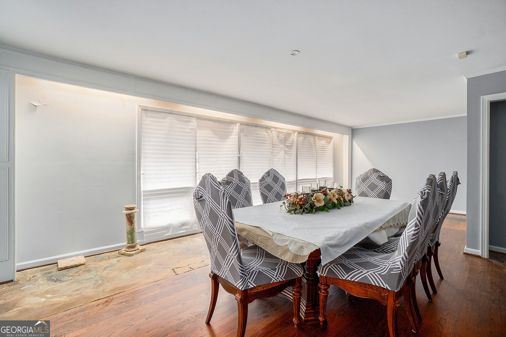 3382 Bobolink Circle Southwest Atlanta, GA 30311 - Photo 3 of 15 a view of a dining room with furniture and wooden floor