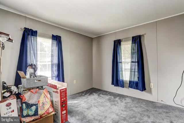 a view of livingroom with furniture and window