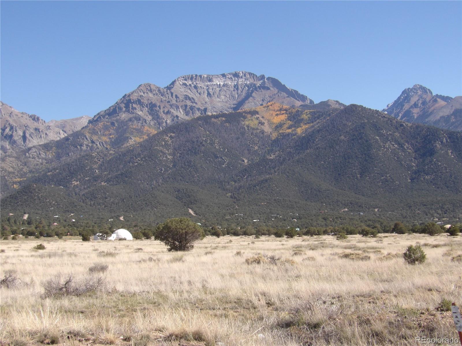836 Pine Cone Road Crestone, CO 81131 - Photo 2 of 4 a view of a yard covered in snow
