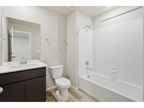 a bathroom with a sink toilet a shower and a mirror