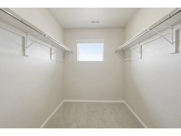 a view of an empty walk in closet