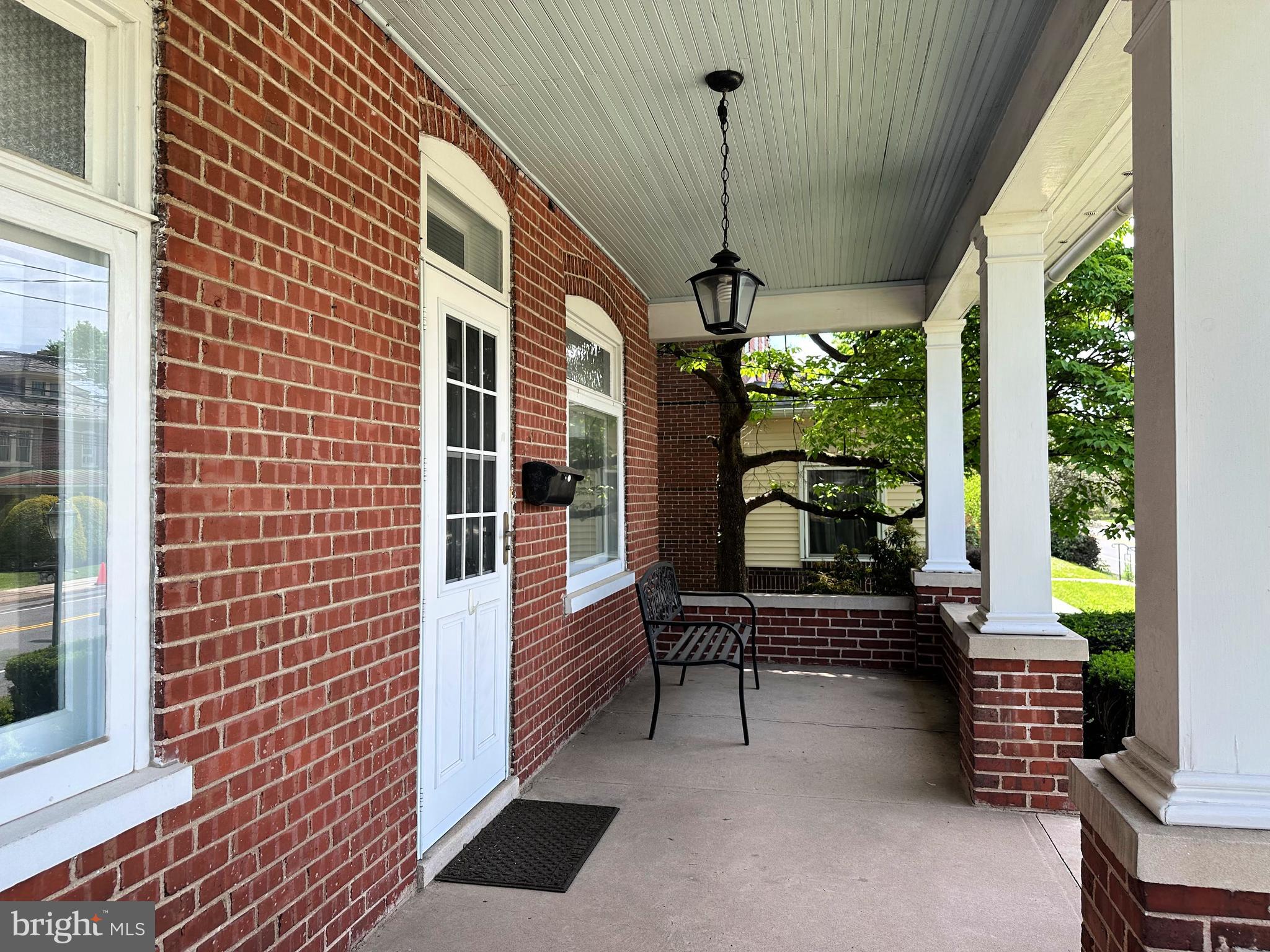 634 Main Street Red Hill, PA 18076 - Photo 4 of 34 a balcony with furniture and a potted plant
