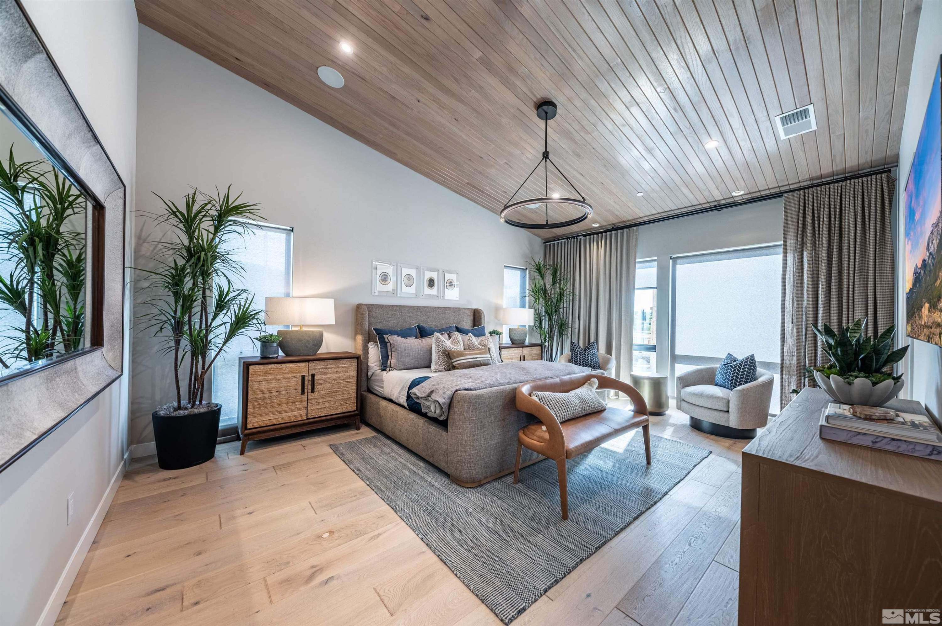 81 Caballada Street Reno, NV 89511 - Photo 13 of 39 a bedroom with furniture and a large window