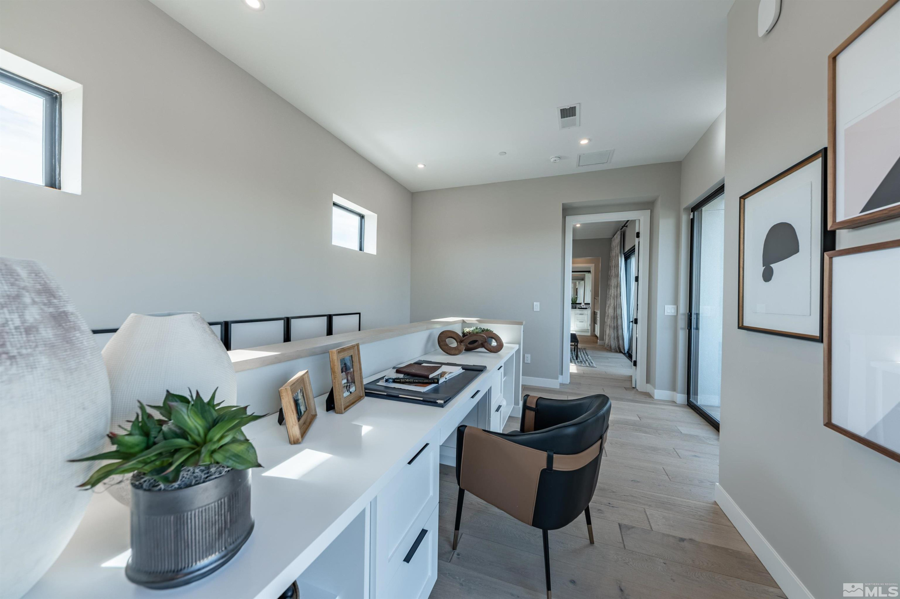 81 Caballada Street Reno, NV 89511 - Photo 23 of 39 a living room with furniture potted plant and a window