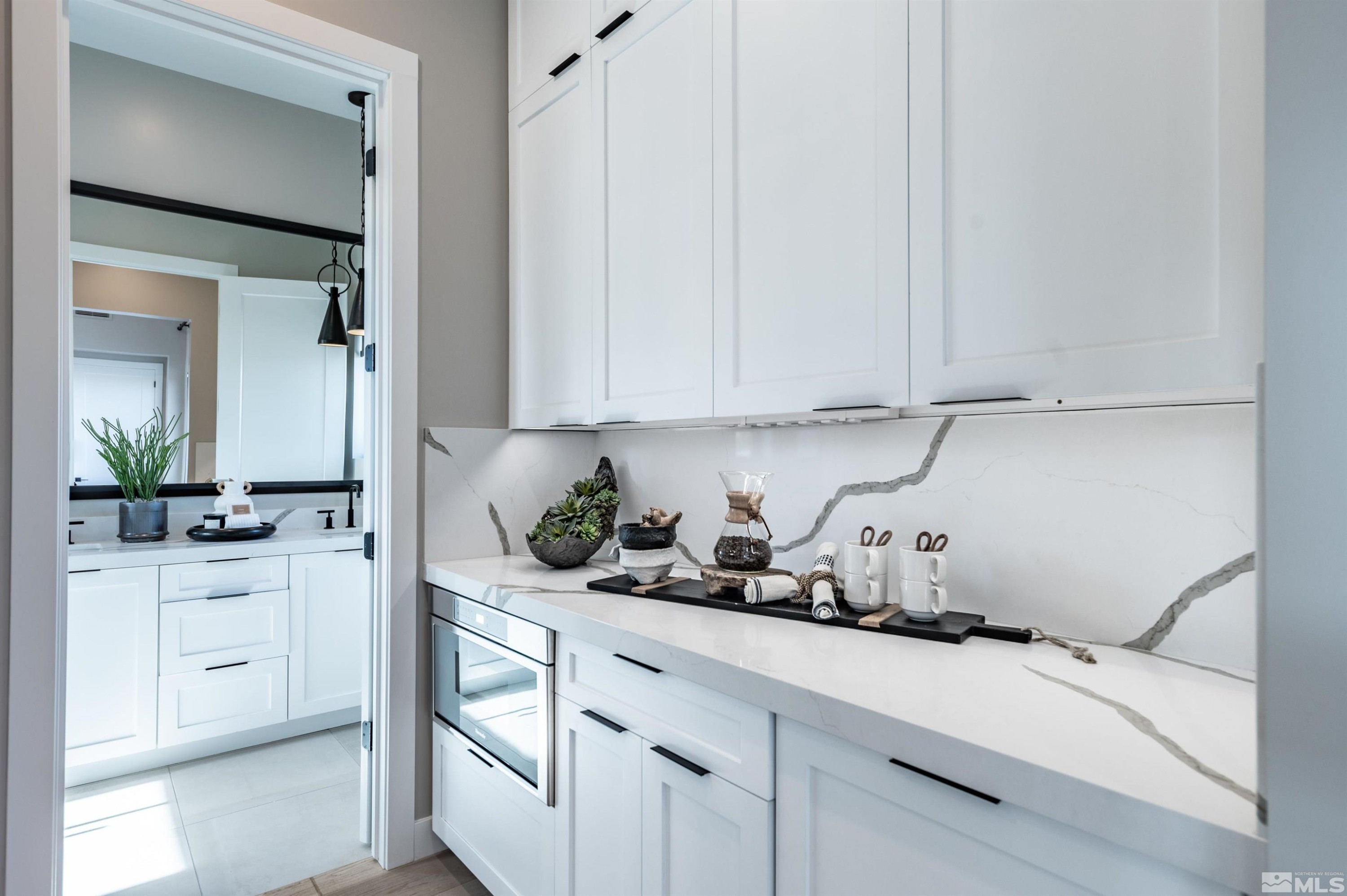 81 Caballada Street Reno, NV 89511 - Photo 25 of 39 a kitchen with white cabinets and a sink