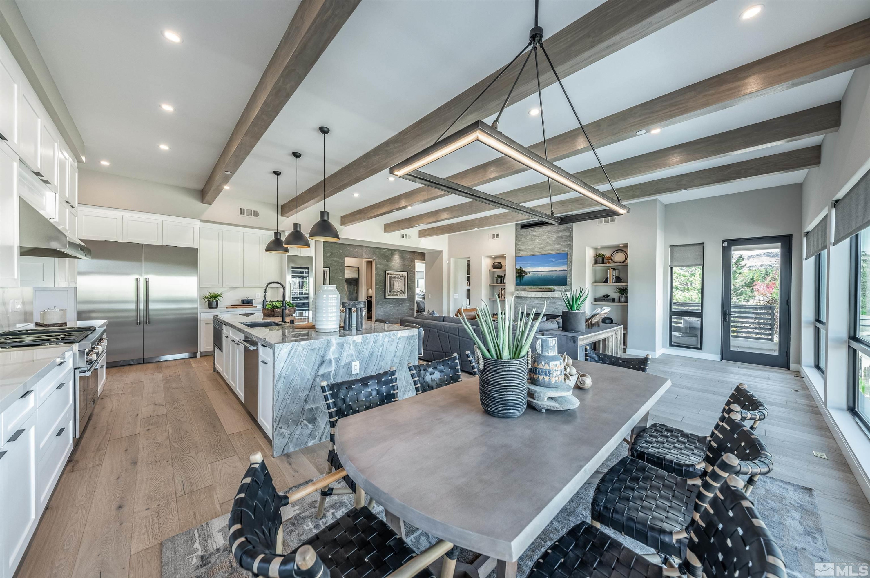 81 Caballada Street Reno, NV 89511 - Photo 5 of 39 a kitchen with a table chairs and wooden floor
