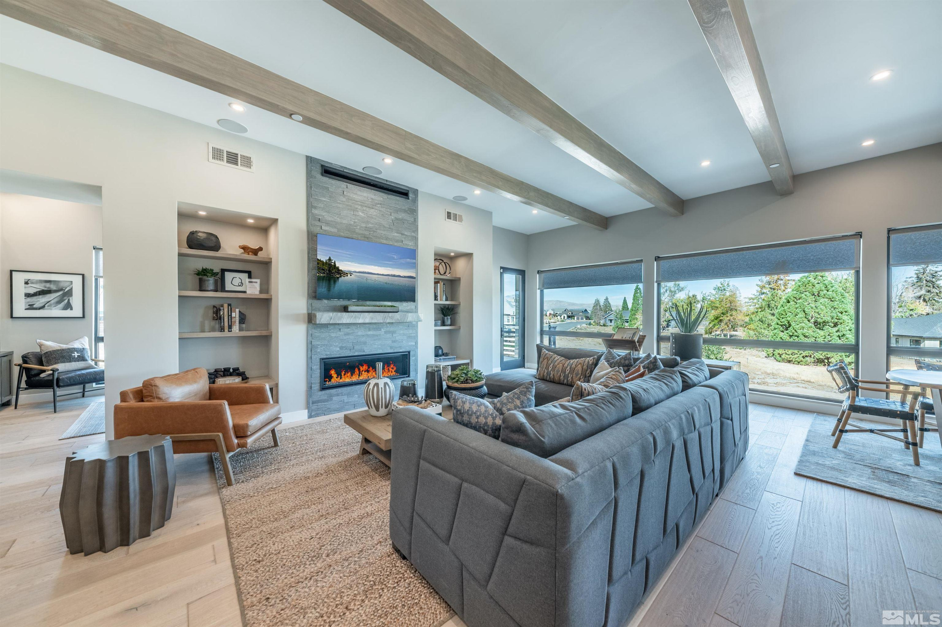 81 Caballada Street Reno, NV 89511 - Photo 7 of 39 a living room with furniture a rug potted plant and a large window
