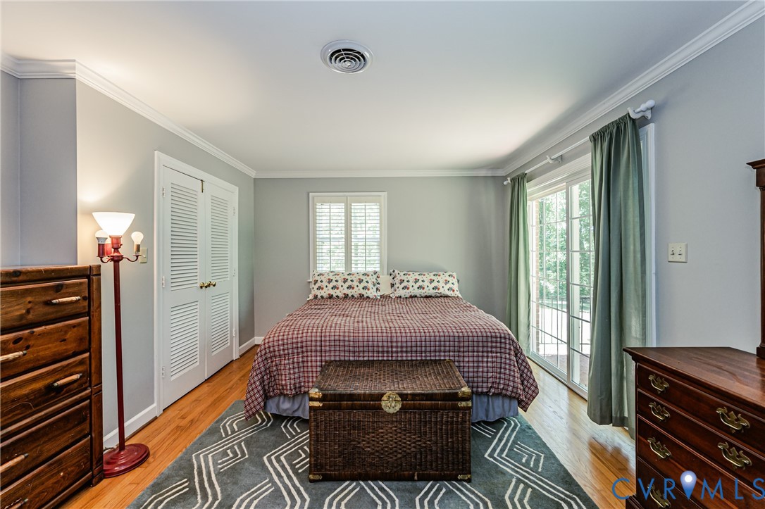 15611 Robert Terrell Road Montpelier, VA 23192 - Photo 14 of 28 Bedroom featuring wood-finish flooring, light gray