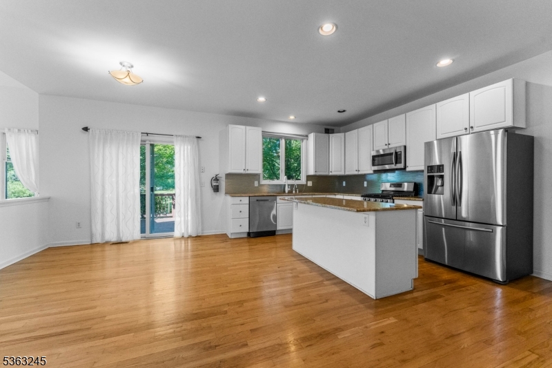 2 Seminole Road Skillman, NJ 08558 - Photo 16 of 50 a kitchen with stainless steel appliances granite countertop a refrigerator a stove top oven a sink and cabinets