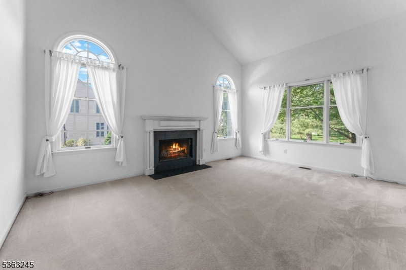 2 Seminole Road Skillman, NJ 08558 - Photo 22 of 50 an empty room with windows fire place and a fireplace