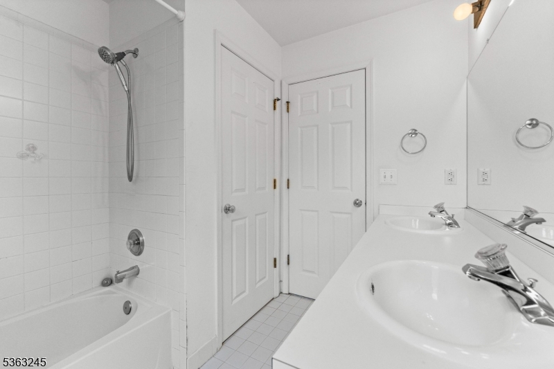 2 Seminole Road Skillman, NJ 08558 - Photo 28 of 50 a bathroom with a tub shower sink and vanity