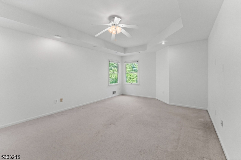 2 Seminole Road Skillman, NJ 08558 - Photo 38 of 50 an empty room with a window and a ceiling fan