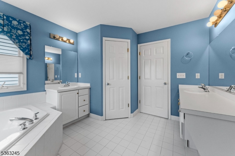 2 Seminole Road Skillman, NJ 08558 - Photo 42 of 50 a bathroom with a sink a toilet and shower