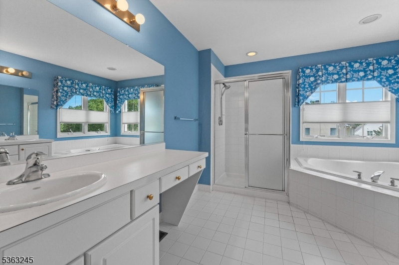 2 Seminole Road Skillman, NJ 08558 - Photo 43 of 50 a spacious bathroom with a tub sink and mirror