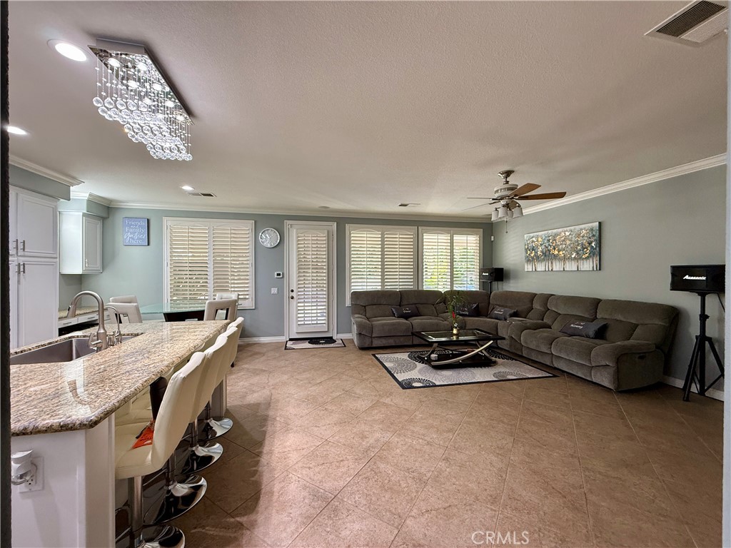 33467 Pitman Lane Menifee, CA 92584 - Photo 11 of 40 a living room with furniture and a chandelier
