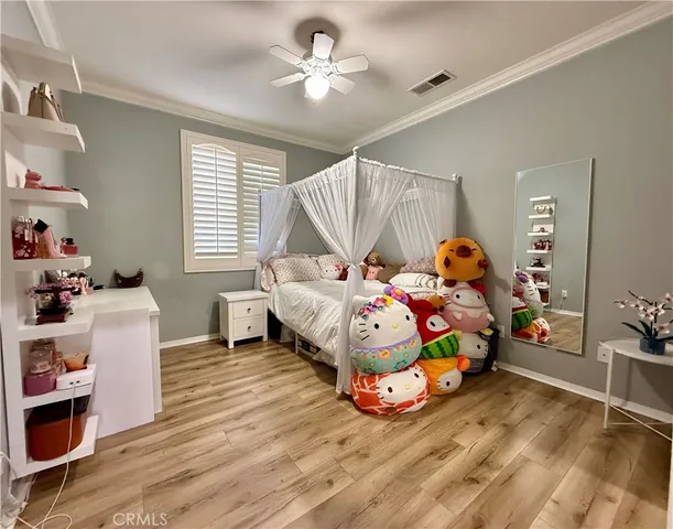 a bedroom with bed and a window