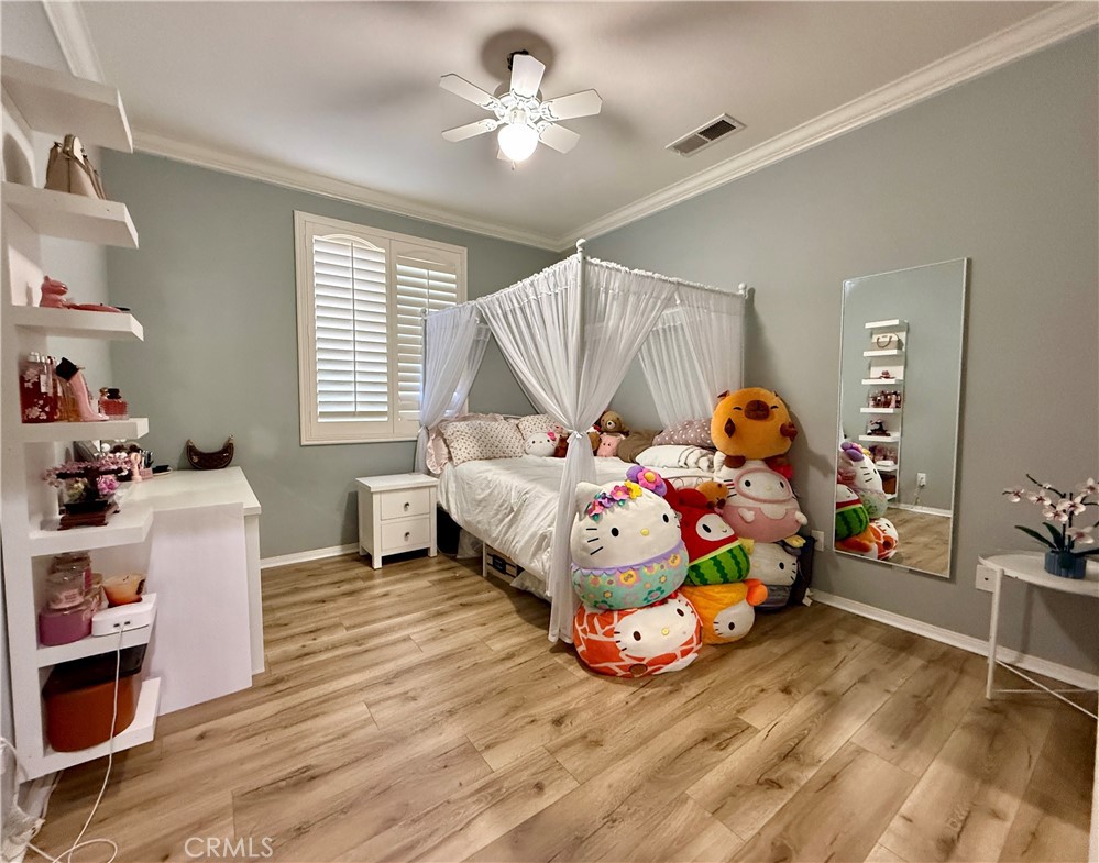 33467 Pitman Lane Menifee, CA 92584 - Photo 19 of 40 a bedroom with bed and a window