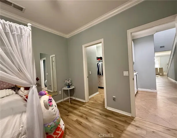 a bedroom with a bed and a mirror