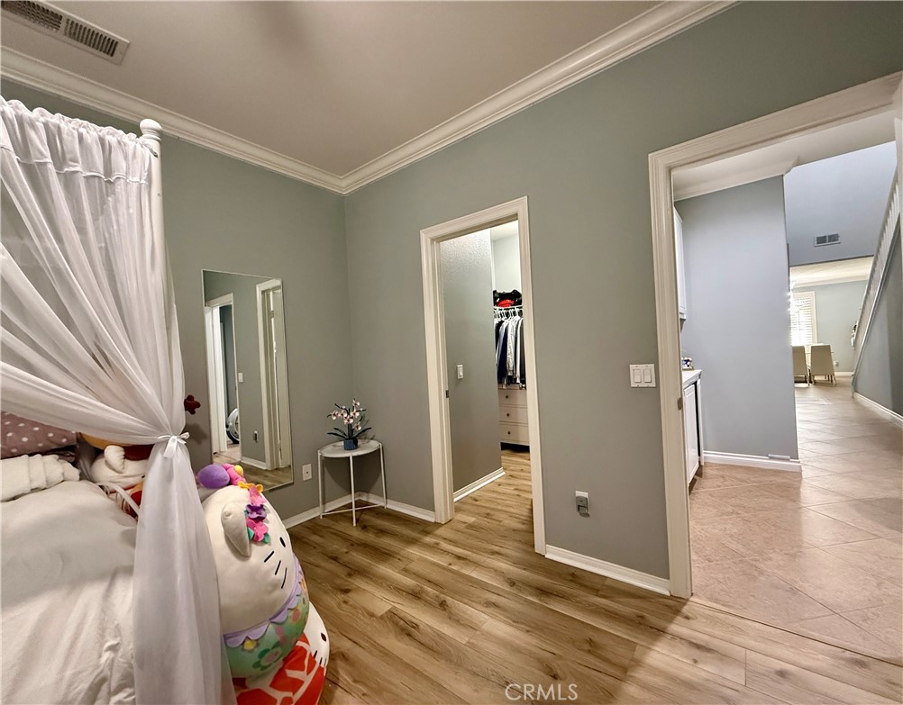 33467 Pitman Lane Menifee, CA 92584 - Photo 20 of 40 a bedroom with a bed and a mirror